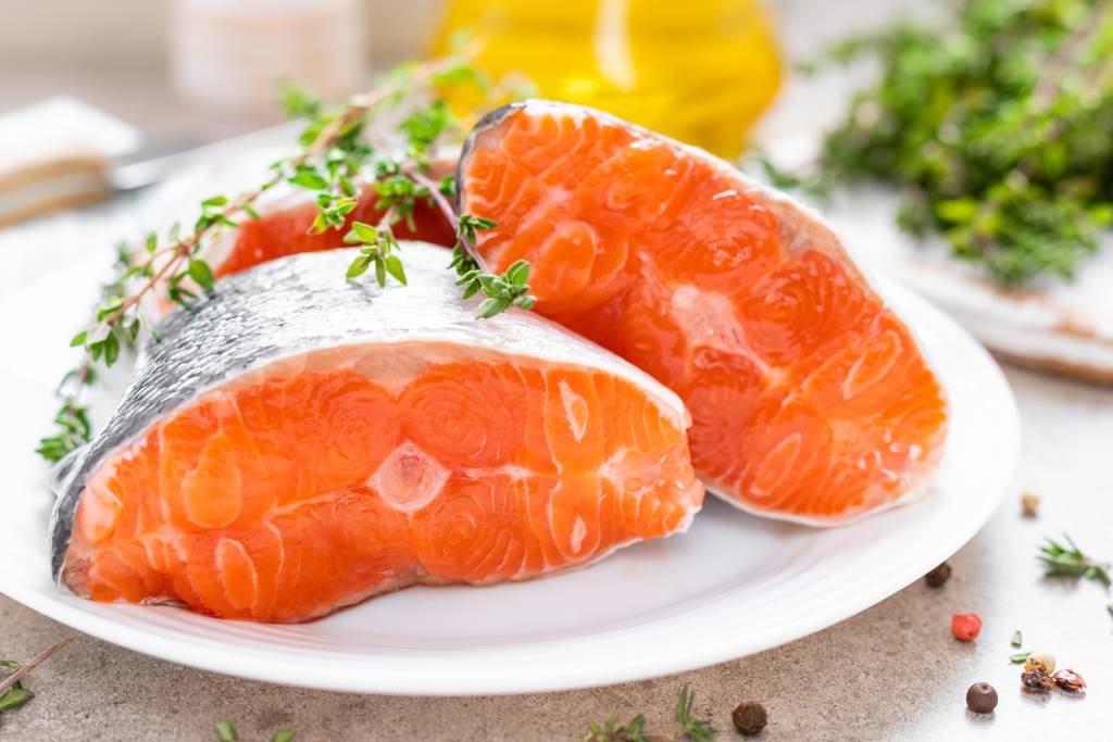 Fatty fish like salmon are said to be fertility-boosting foods for women.