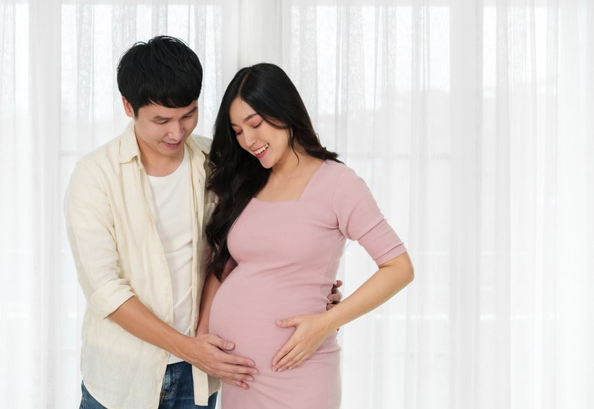 A happy couple awaits the birth of their child
