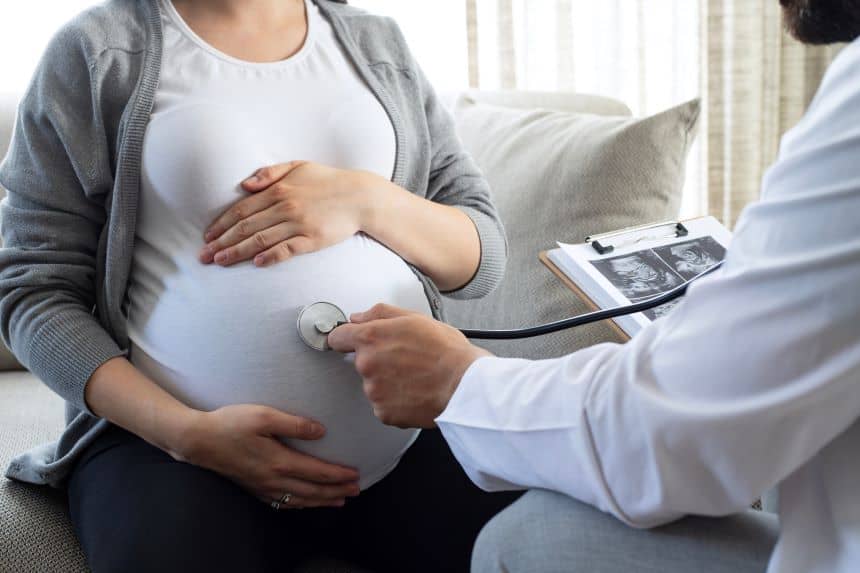 A pregnant woman getting her belly checked