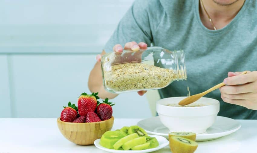 Man eating antioxidant-rich foods to improve sperm health