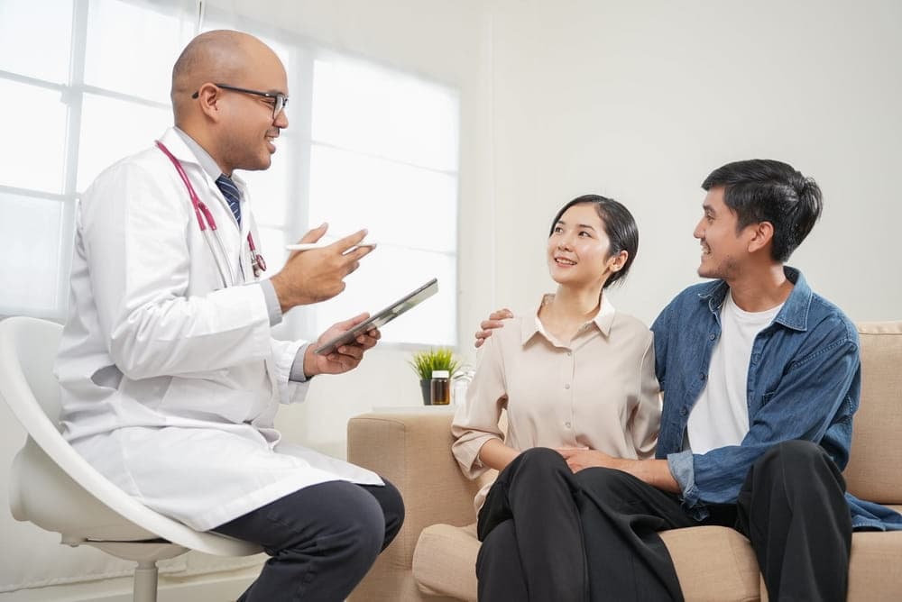 Couple consulting a doctor to improve their chances of getting pregnant